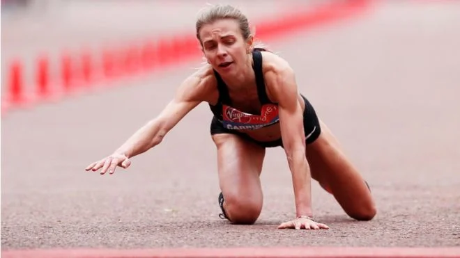 Courageous British Runner Crawls Across