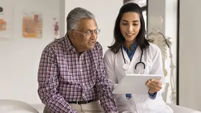 Doctor discussing medical information with a senior patient during a consultation, reviewing details on a digital tablet in a healthcare clinic. The image highlights health insurance planning, preventive healthcare, medical guidance, senior citizen health coverage, and informed healthcare decisions.