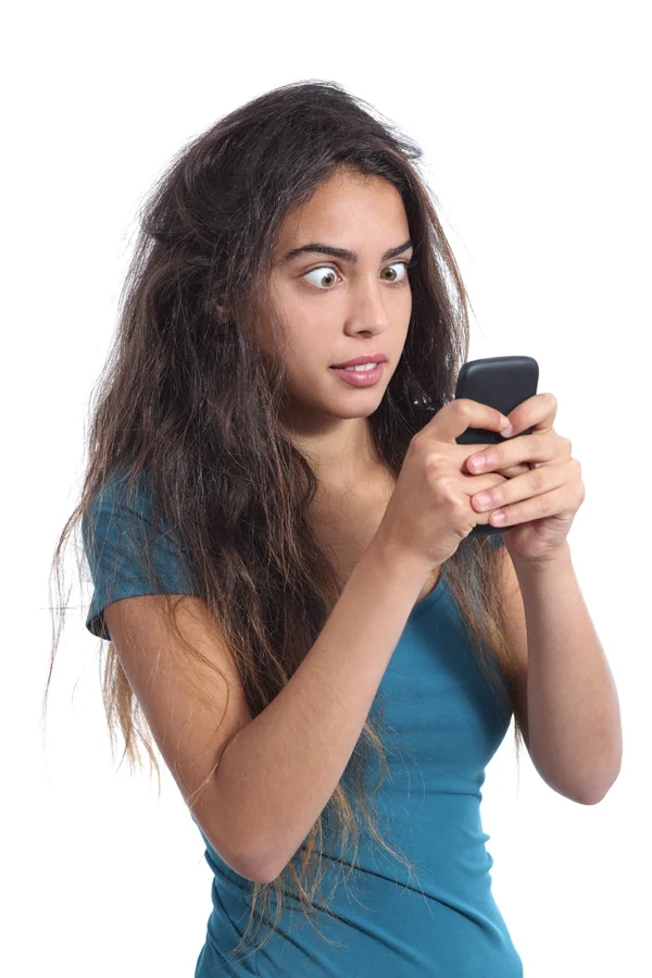 Obsessed teenager girl with the mobile phone technology